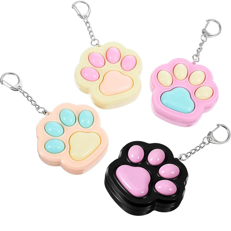 Porte-clés anti-stress patte de chat - porté sur sac